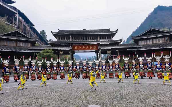 Robot dogs dance their way into the hearts of visitors at Xijiang Qianhu Miao Village in SW China's Guizhou