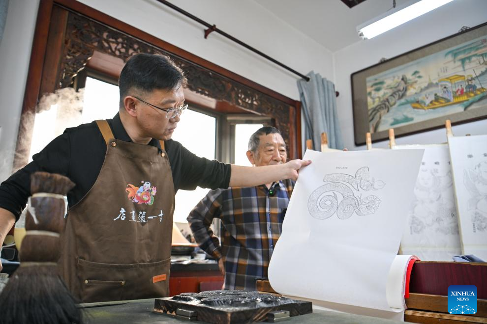 Products with Yangliuqing woodblock new year pictures created under inspiration of Year of Snake in Tianjin